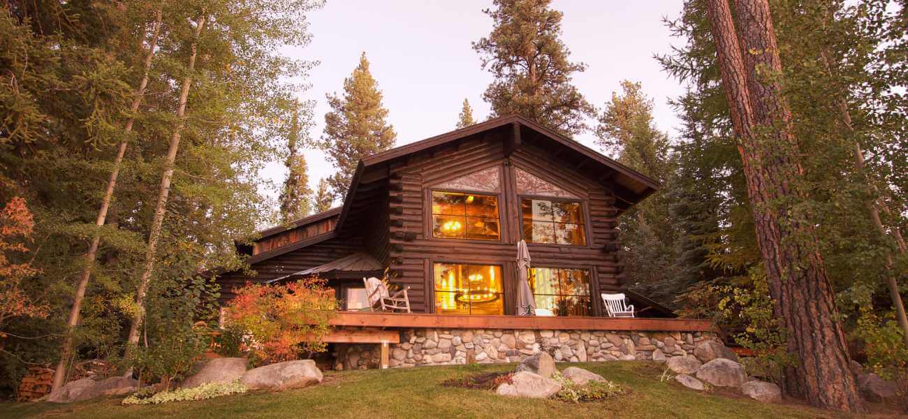 Large wood cabin in the lush forest
